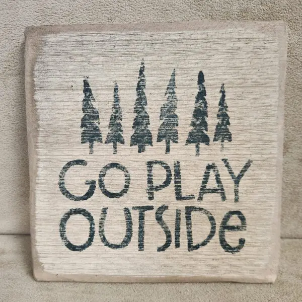 Cloth with trees and 'Go Play Outside' text.