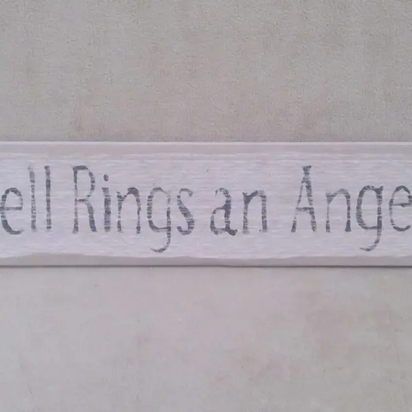 A sign reads 'Bell Rings an Angel'.
