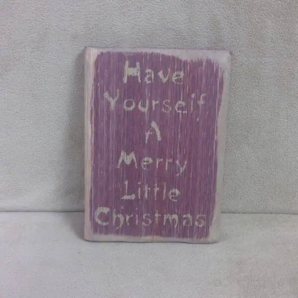 Rustic purple sign with "Have Yourself A Merry Little Christmas" text.