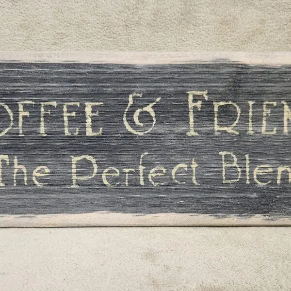 Rustic wooden sign saying 'Coffee & Friends The Perfect Blend'.